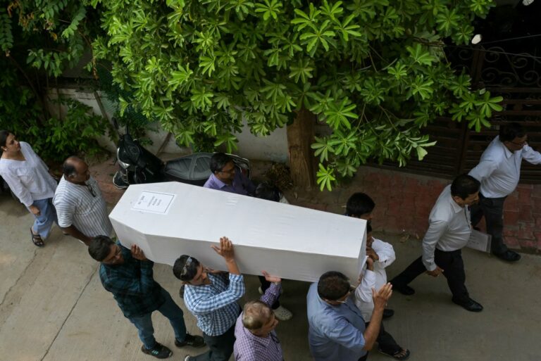Relatives-carry-the-coffin-of-a-victim-who-was-killed-in-the-Air-India-Flight-171-crash